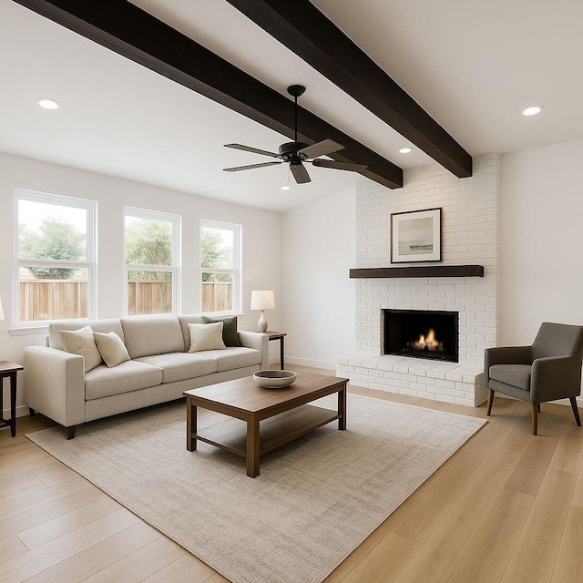living room with beam ceiling, a brick fireplace, ceiling fan, light wood finished floors, and recessed lighting