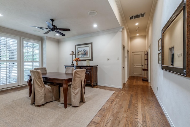 dining area with recessed lighting, visible vents, baseboards, light wood-style floors, and crown molding