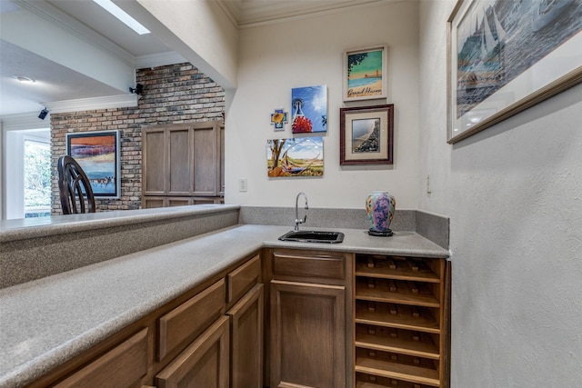 bar featuring crown molding and a sink