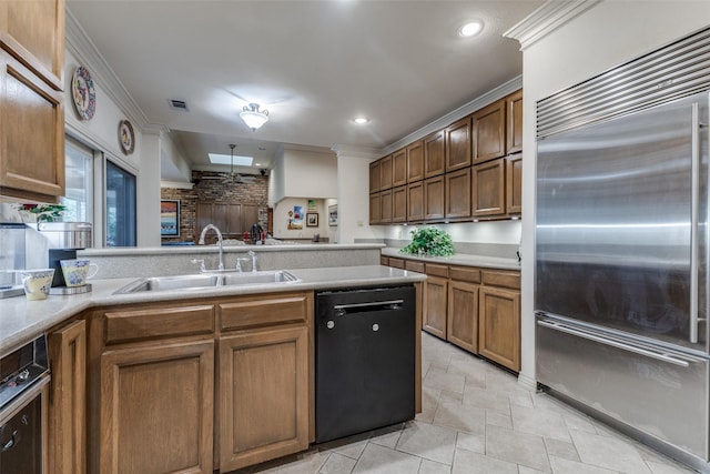 kitchen featuring a sink, black dishwasher, light countertops, ornamental molding, and stainless steel built in fridge