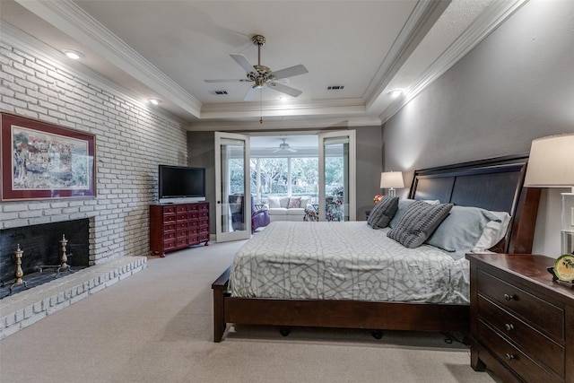 carpeted bedroom featuring a brick fireplace, access to outside, visible vents, and crown molding