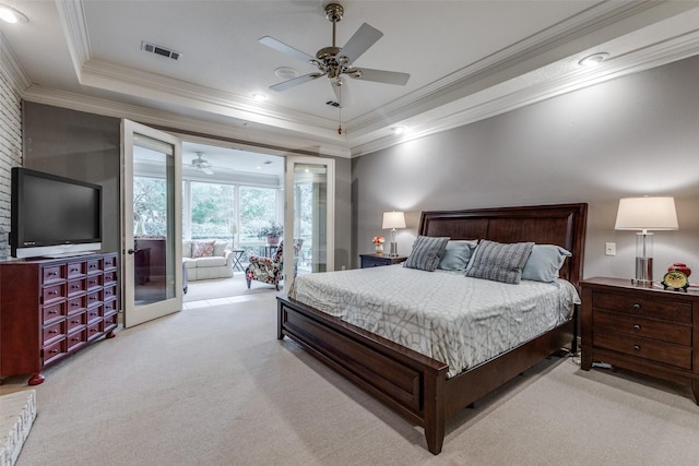 bedroom featuring a raised ceiling, visible vents, ornamental molding, carpet flooring, and access to outside