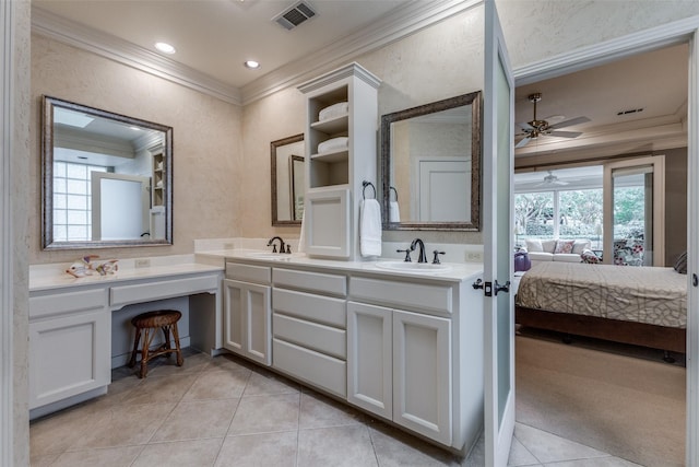 ensuite bathroom featuring crown molding, connected bathroom, visible vents, and a sink