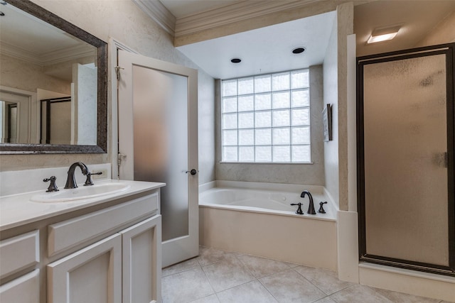 full bathroom featuring crown molding, a shower stall, vanity, a bath, and tile patterned floors