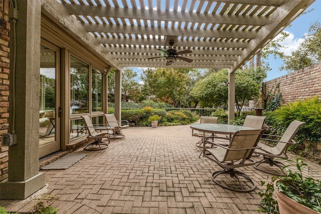 view of patio / terrace featuring outdoor dining area, fence, and a pergola