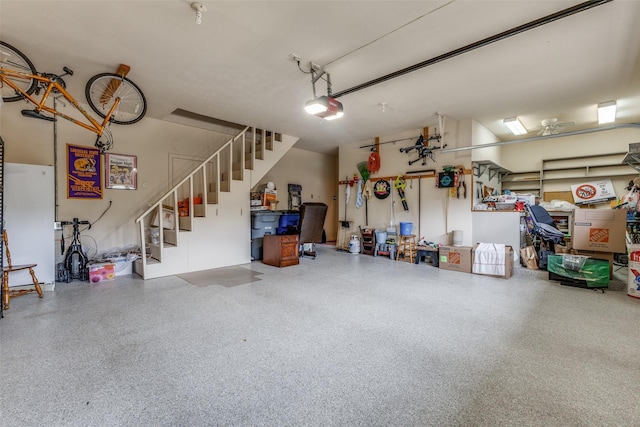 garage with a garage door opener and freestanding refrigerator