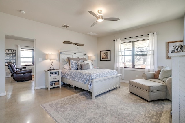 bedroom featuring concrete flooring, ceiling fan, visible vents, and baseboards