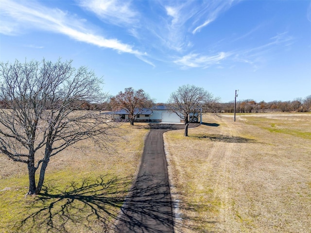 view of road with driveway