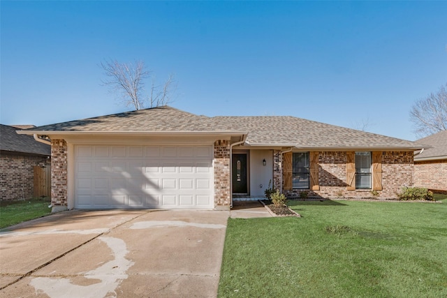 ranch-style home with a garage, concrete driveway, a front lawn, and brick siding