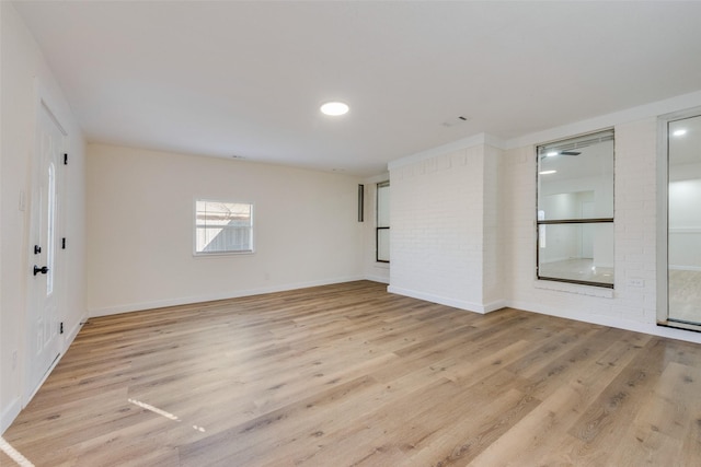 spare room with wood finished floors