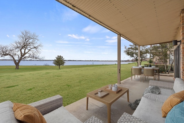 view of patio featuring a water view, outdoor dining area, and an outdoor living space