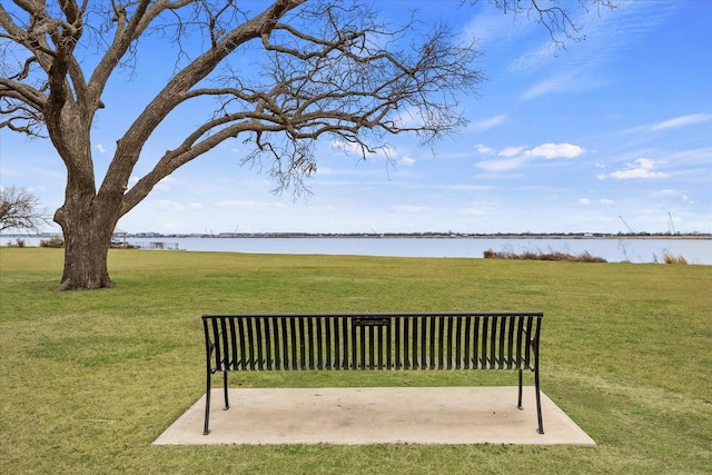 view of home's community featuring a yard and a water view