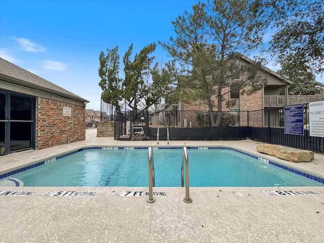 community pool featuring fence