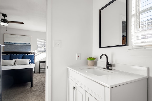 bathroom with a ceiling fan and vanity