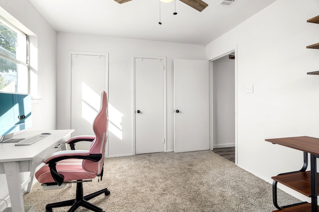 office area with carpet, visible vents, ceiling fan, and baseboards