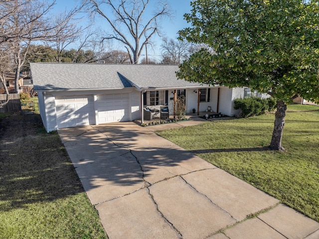 single story home featuring a shingled roof, covered porch, an attached garage, driveway, and a front lawn