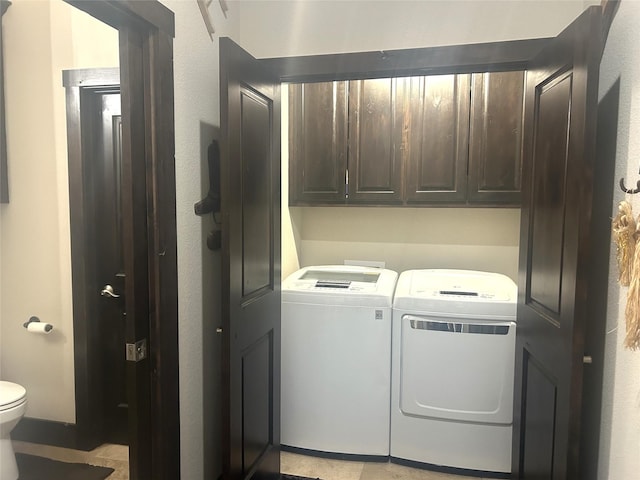 clothes washing area featuring independent washer and dryer