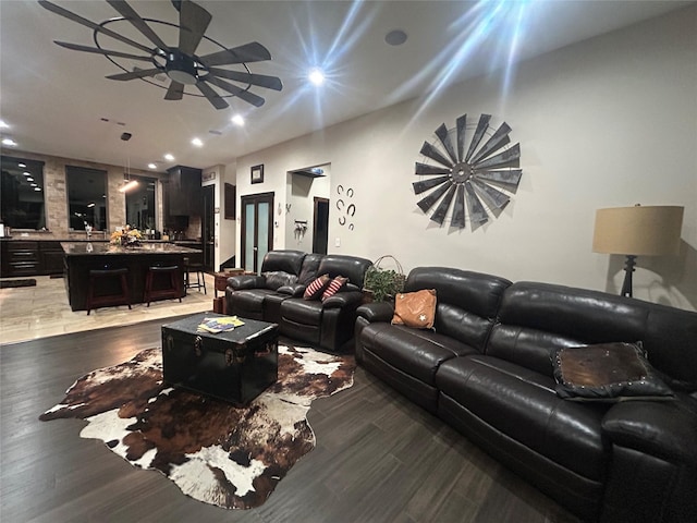 living area with ceiling fan, recessed lighting, and light wood-style floors