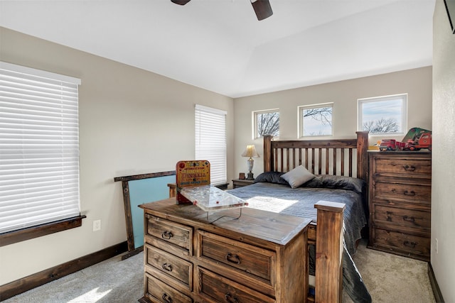 carpeted bedroom featuring lofted ceiling, ceiling fan, and baseboards