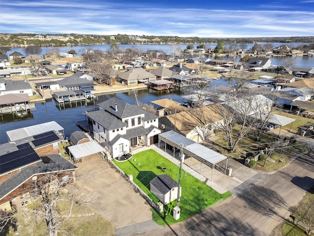 bird's eye view with a residential view and a water view