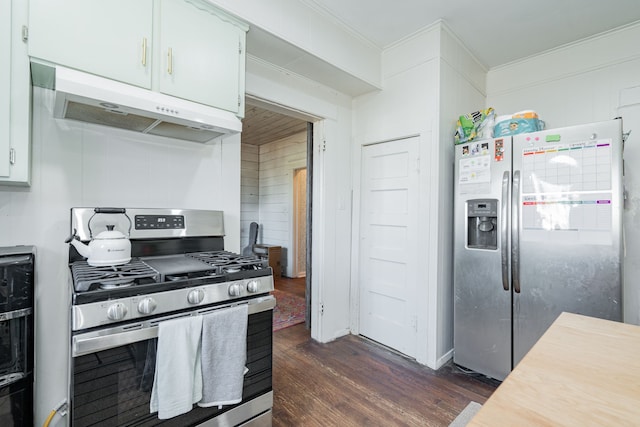 kitchen featuring under cabinet range hood, stainless steel appliances, dark wood-type flooring, white cabinetry, and ornamental molding