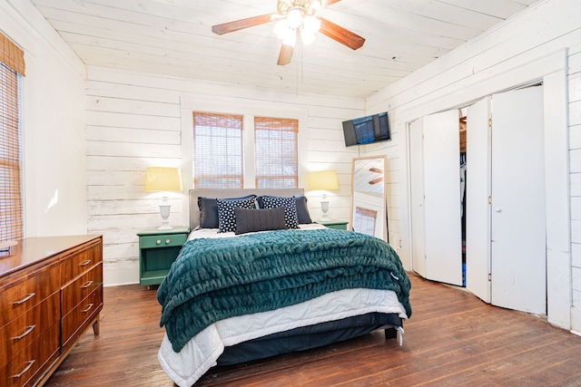 bedroom featuring wooden ceiling, wooden walls, and wood finished floors