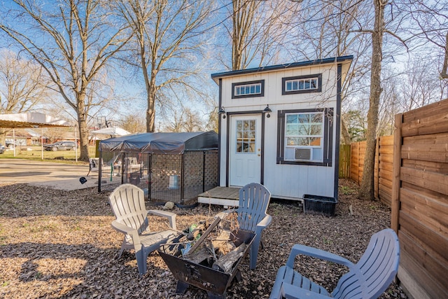 view of outbuilding featuring an outbuilding and fence