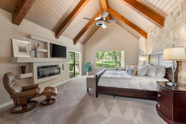 bedroom with high vaulted ceiling, carpet floors, access to outside, beamed ceiling, and a glass covered fireplace