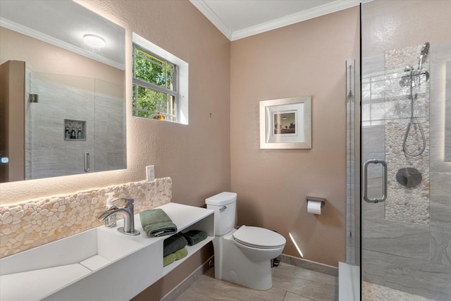 bathroom with toilet, a shower stall, ornamental molding, and vanity