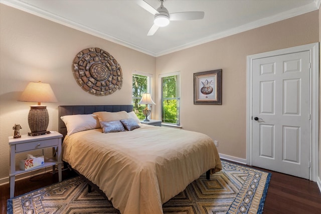 bedroom featuring ceiling fan, baseboards, wood finished floors, and ornamental molding