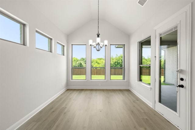 4814 Nomad Dr, Midlothian, TX 76065 - unfurnished dining area with a chandelier, light wood-type flooring, baseboards, and vaulted ceiling