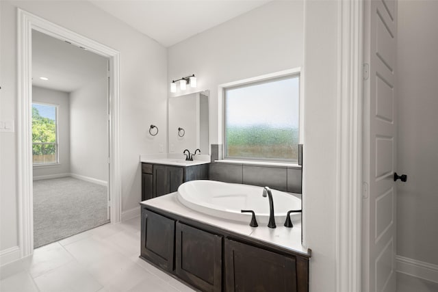 4814 Nomad Dr, Midlothian, TX 76065 - full bathroom featuring a garden tub, vanity, and baseboards
