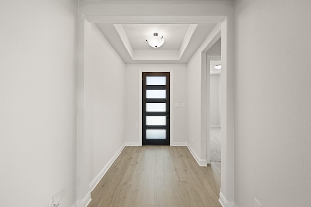 4814 Nomad Dr, Midlothian, TX 76065 - foyer entrance with light wood finished floors, a raised ceiling, and baseboards