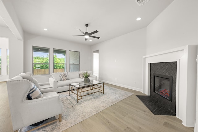 4814 Nomad Dr, Midlothian, TX 76065 - living room with wood finished floors, recessed lighting, a ceiling fan, a fireplace with flush hearth, and baseboards