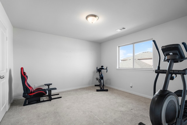 exercise room featuring carpet, visible vents, and baseboards