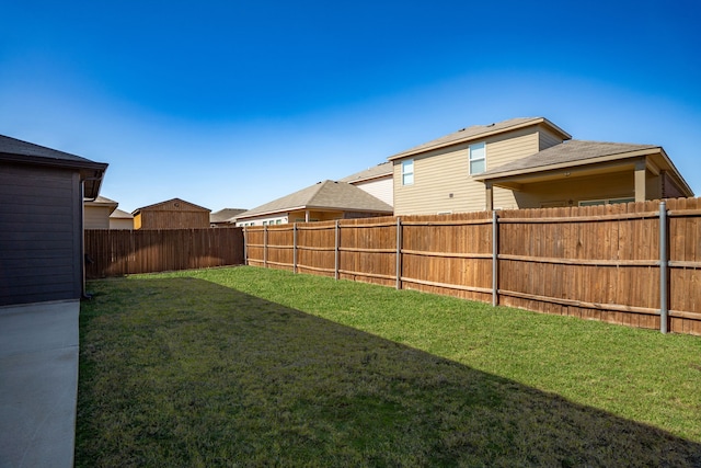 view of yard with a fenced backyard