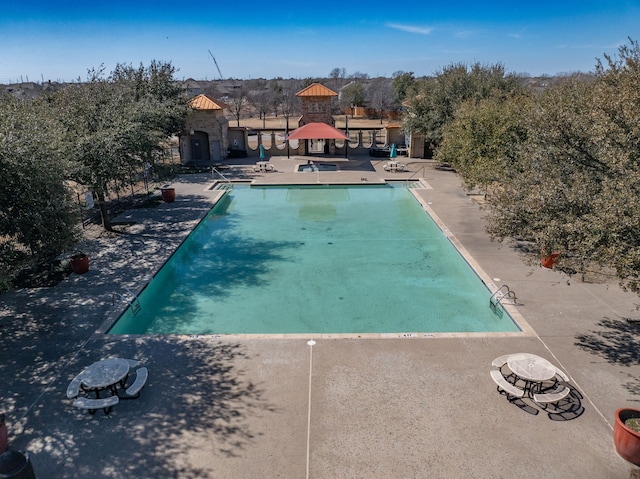 community pool with a patio area