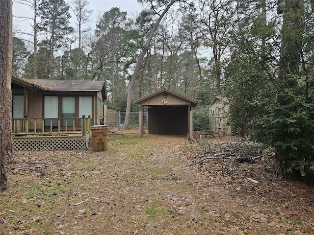 view of yard featuring fence and a deck