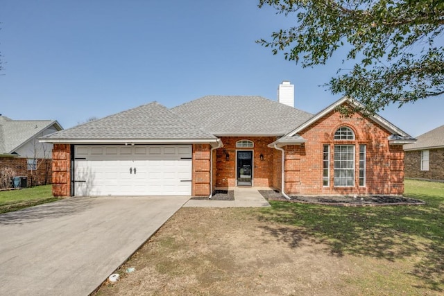 ranch-style home with driveway, a garage, a chimney, a front yard, and brick siding