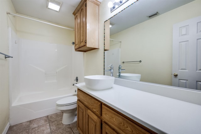 bathroom featuring toilet, bathing tub / shower combination, vanity, visible vents, and tile patterned floors