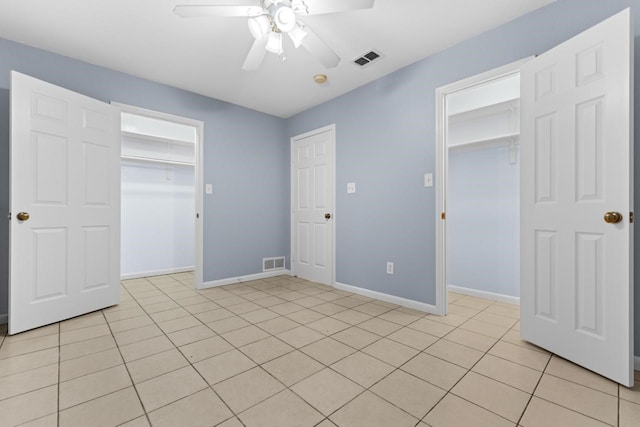 unfurnished bedroom featuring a closet, visible vents, and baseboards