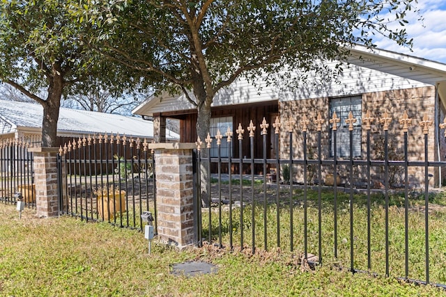 view of front of property with fence and brick siding