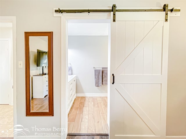 bathroom featuring baseboards and wood finished floors