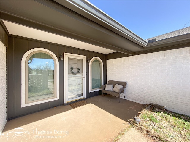 entrance to property with brick siding