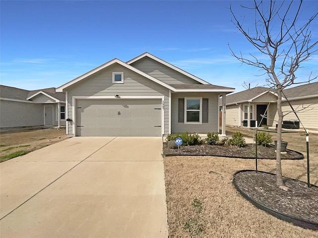 view of front of house with concrete driveway and an attached garage