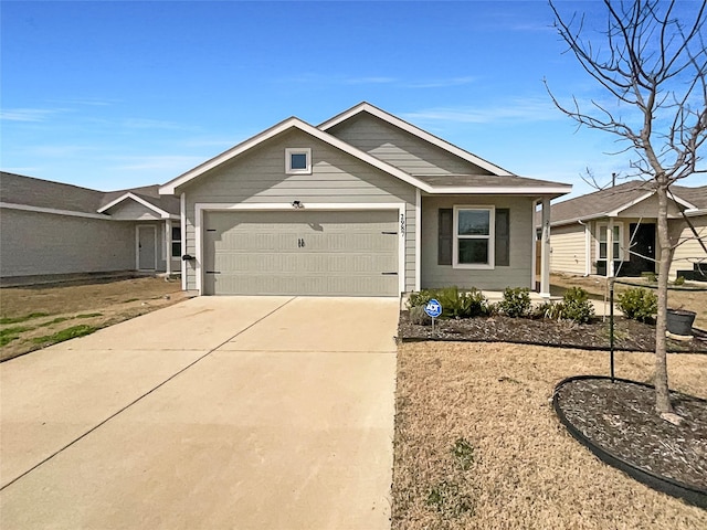 view of front facade featuring concrete driveway and an attached garage