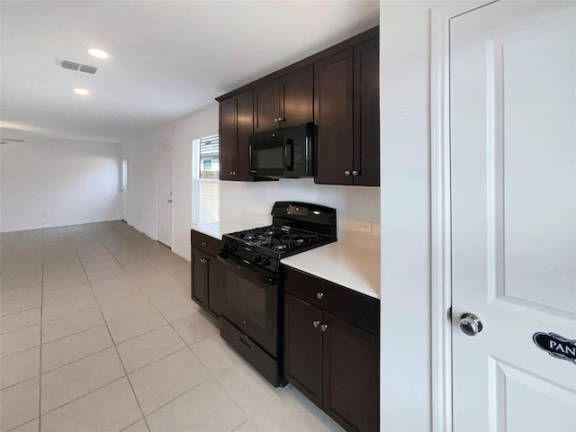 kitchen featuring light tile patterned floors, visible vents, light countertops, black appliances, and recessed lighting