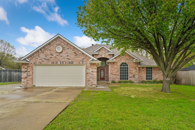 view of front of house with a garage, concrete driveway, fence, a front yard, and brick siding