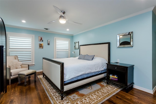 bedroom with dark wood-type flooring, visible vents, ornamental molding, and baseboards