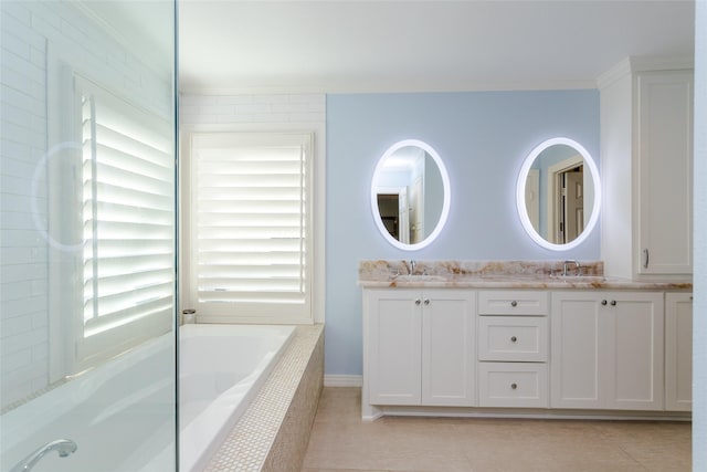 bathroom with a sink, a bath, tile patterned floors, double vanity, and crown molding